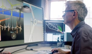 Engineer working on autoCAD on his computer 