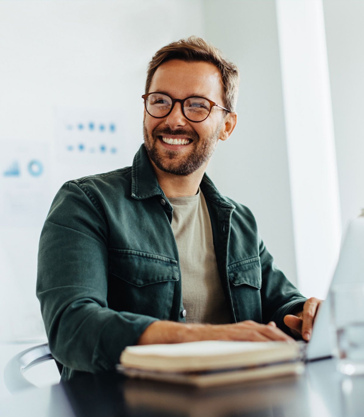 Happy-business-man-listening-to-a-discussion-in-an-office