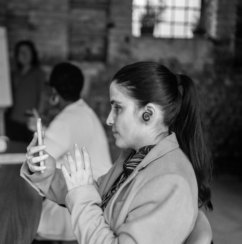 Vignette Visually impaired woman using a smartphone and headphones